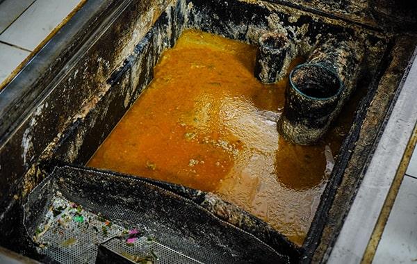 delaying grease trap cleaning can result in foul odors, sanitation problems, and costly repairs